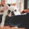Man relaxing in chair with dog in his lap